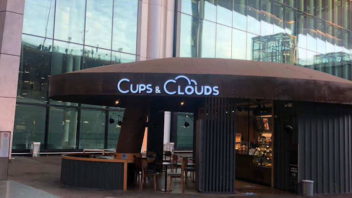 Cups & Clouds Coffee Kiosk at Arrival Plaza